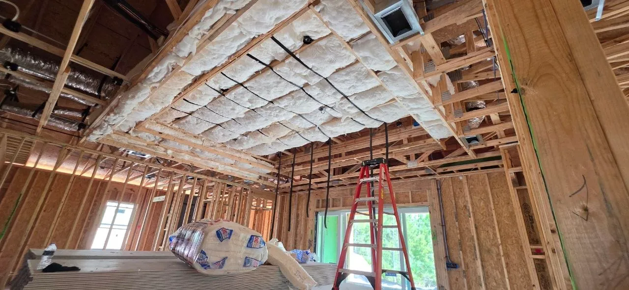 R-30 fiberglass insulation being installed in a tray ceiling