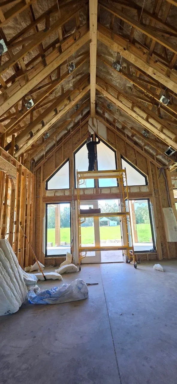 Bare framing with cathedral windows before insulation